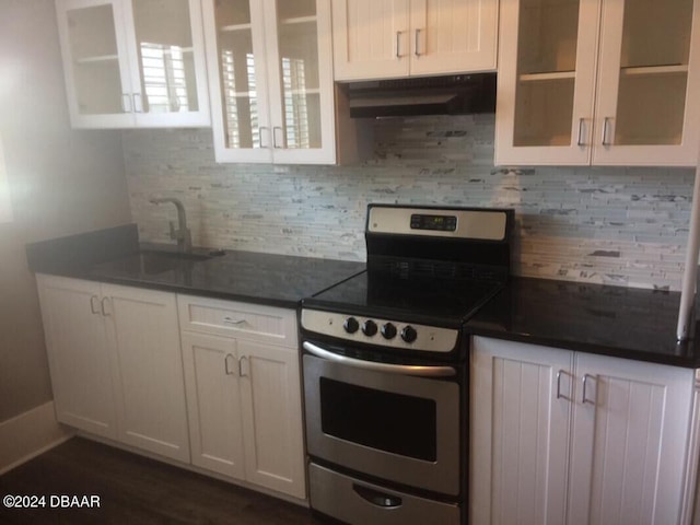 kitchen featuring dark hardwood / wood-style flooring, electric stove, white cabinets, decorative backsplash, and sink