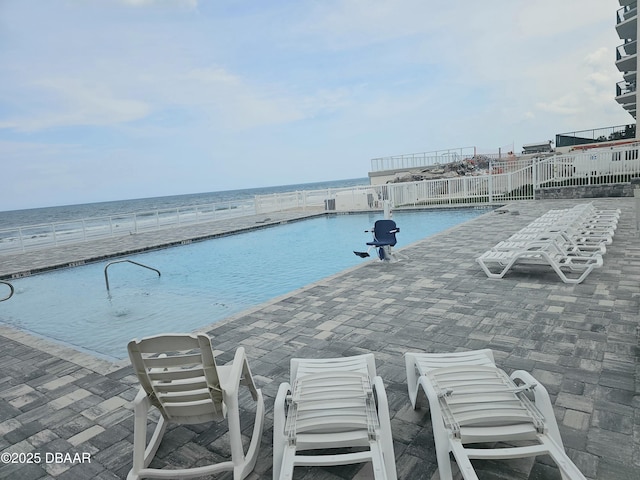 2043 S Atlantic Ave Unit 415, Daytona Beach, FL 32118 - community pool featuring a patio