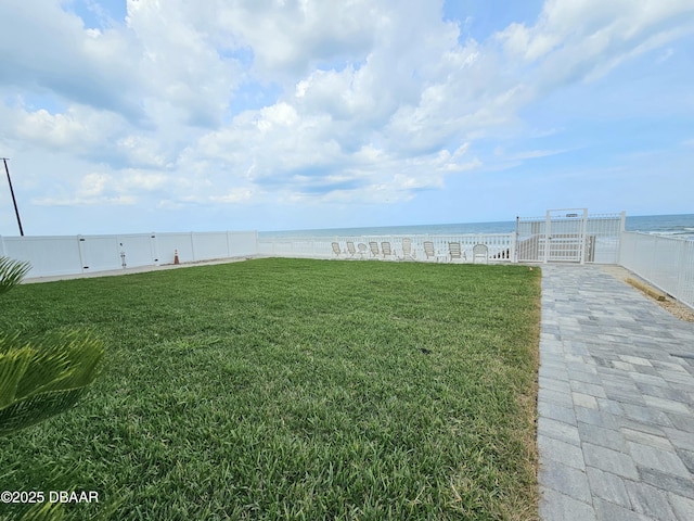 2043 S Atlantic Ave Unit 415, Daytona Beach, FL 32118 - view of yard with a gate and a water view