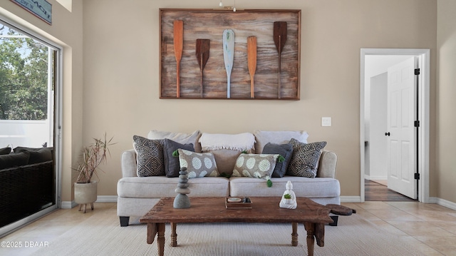 156 Holly Hill Ct, New Smyrna Beach, FL 32168 - living area with baseboards and light tile patterned floors