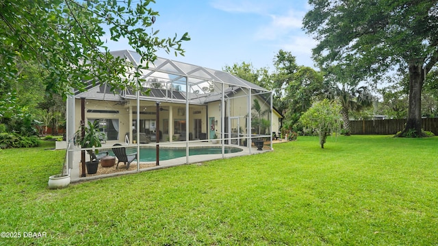 156 Holly Hill Ct, New Smyrna Beach, FL 32168 - back of house with a patio, ceiling fan, an outdoor pool, and a lanai