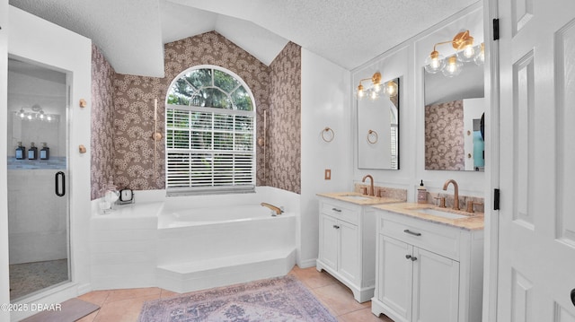 156 Holly Hill Ct, New Smyrna Beach, FL 32168 - bathroom with lofted ceiling, tile patterned floors, a garden tub, vanity, and a stall shower