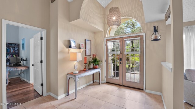156 Holly Hill Ct, New Smyrna Beach, FL 32168 - tiled entrance foyer featuring a high ceiling and french doors