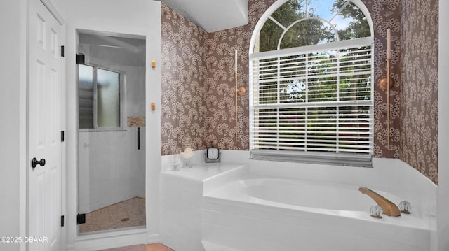 156 Holly Hill Ct, New Smyrna Beach, FL 32168 - full bathroom with wallpapered walls, a bath, and a shower stall