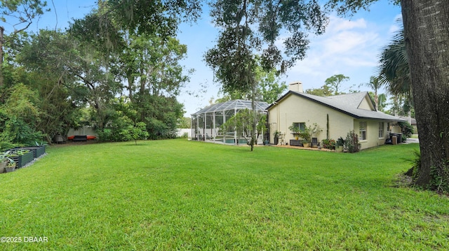 156 Holly Hill Ct, New Smyrna Beach, FL 32168 - view of green lawn featuring a pool and a lanai