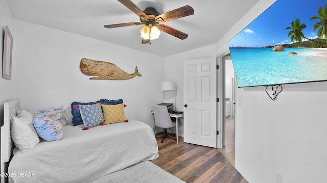 156 Holly Hill Ct, New Smyrna Beach, FL 32168 - bedroom with wood finished floors and a ceiling fan