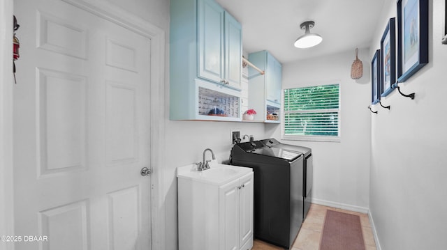 156 Holly Hill Ct, New Smyrna Beach, FL 32168 - laundry room featuring washer and dryer and cabinet space