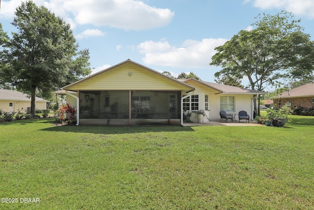 113 Bridgehaven Dr, Palm Coast, FL 32137 - rear view of house with a sunroom, a patio area, and a yard