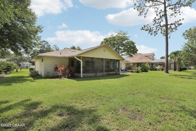 113 Bridgehaven Dr, Palm Coast, FL 32137 - rear view of property featuring a sunroom and a lawn