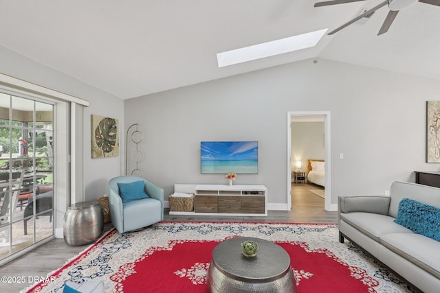 113 Bridgehaven Dr, Palm Coast, FL 32137 - living area with wood finished floors, a ceiling fan, a skylight, and vaulted ceiling