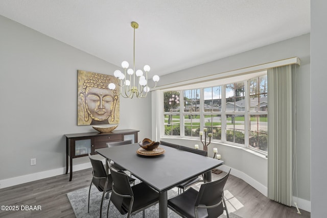 113 Bridgehaven Dr, Palm Coast, FL 32137 - dining room featuring wood finished floors and a chandelier