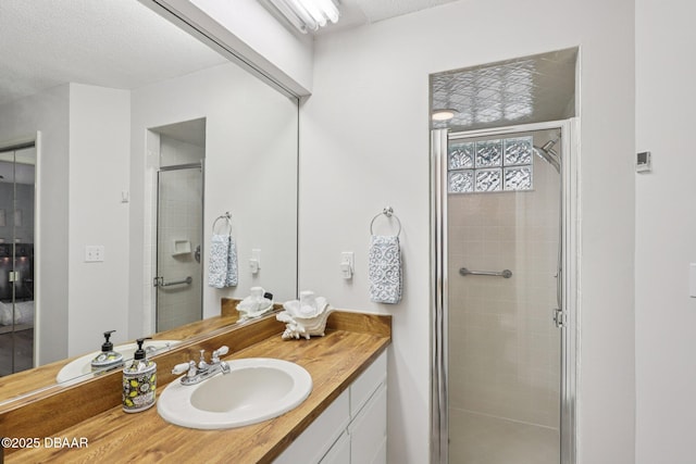 113 Bridgehaven Dr, Palm Coast, FL 32137 - bathroom with vanity, a stall shower, and a textured ceiling