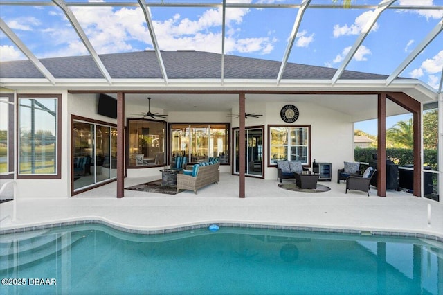 1305 Dovercourt Ln, Ormond Beach, FL 32174 - swimming pool featuring an outdoor hangout area, a ceiling fan, a patio area, and glass enclosure
