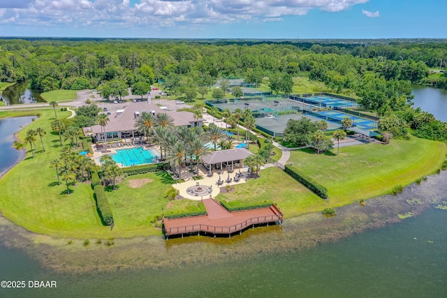 1305 Dovercourt Ln, Ormond Beach, FL 32174 - bird's eye view of a large body of water, a pool, and a heavily wooded area