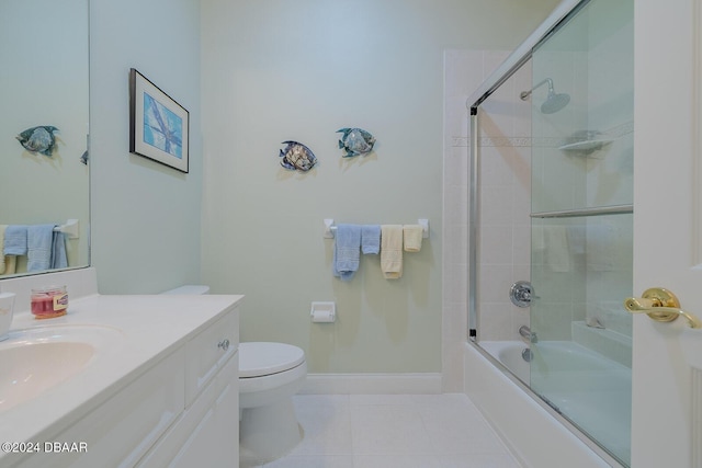 full bathroom featuring tile patterned flooring, vanity, toilet, and enclosed tub / shower combo