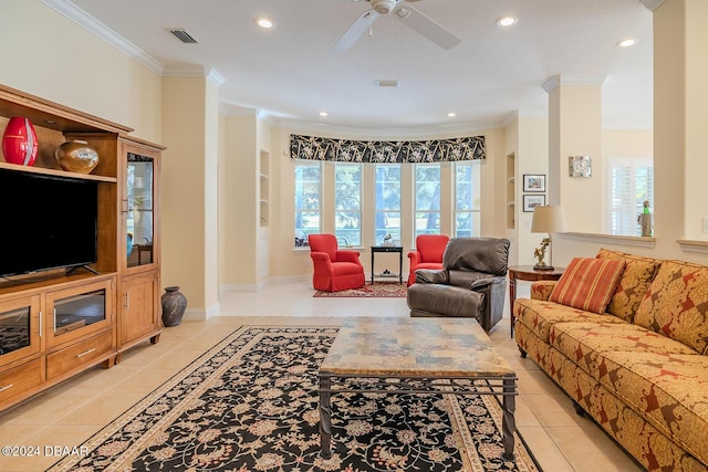 living room with ceiling fan, light tile patterned floors, and ornamental molding