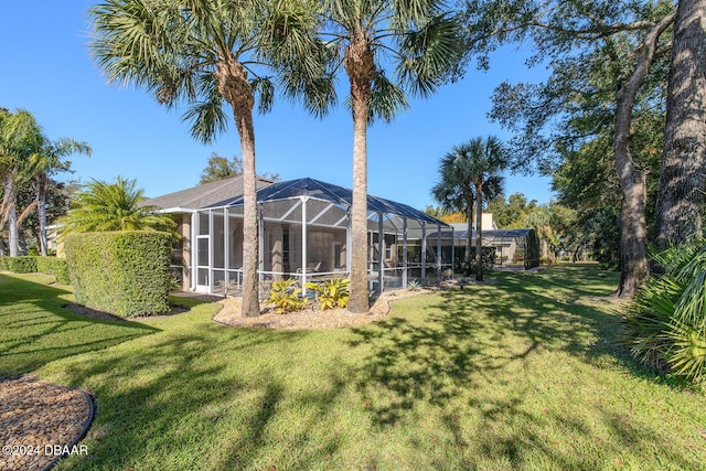 view of yard with a lanai