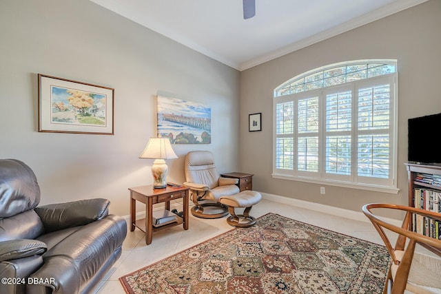 sitting room with ceiling fan, light tile patterned floors, and ornamental molding