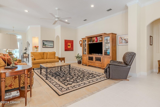 tiled living room featuring ceiling fan and ornamental molding