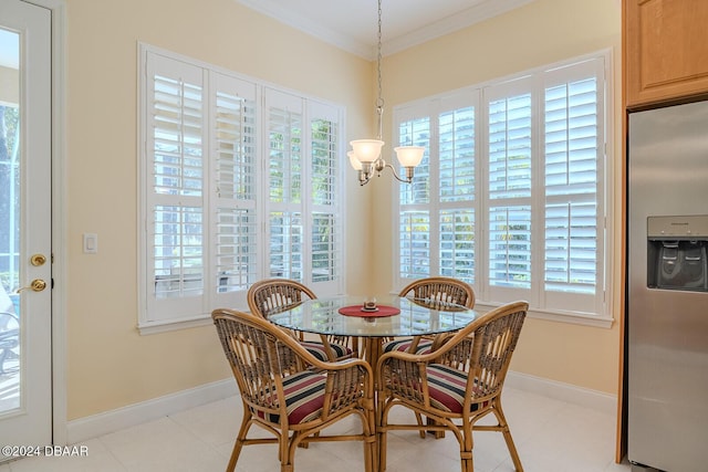 dining space featuring crown molding, light tile patterned floors, a healthy amount of sunlight, and an inviting chandelier