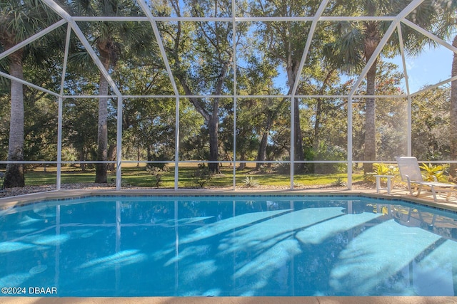 view of pool featuring a lanai