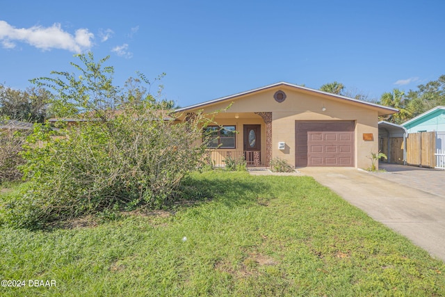 view of front of house featuring a garage and a front yard