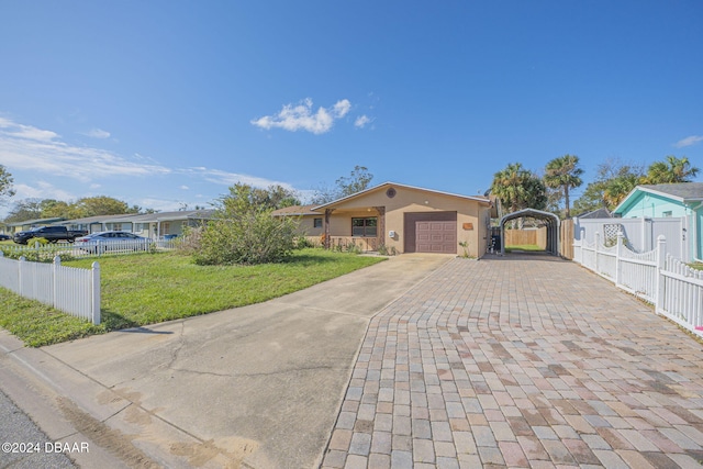 view of front of home with a garage and a front lawn