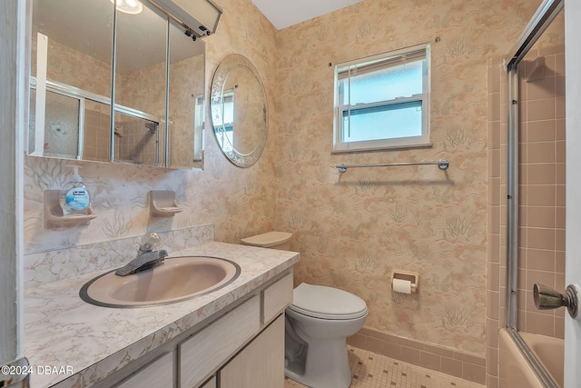 full bathroom with toilet, vanity, tile patterned flooring, and shower / bath combination with glass door