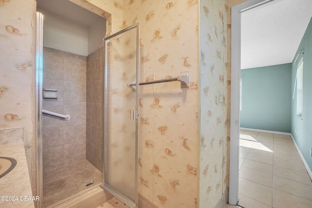 bathroom featuring walk in shower and tile patterned floors