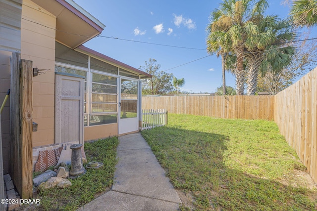 view of yard featuring a sunroom