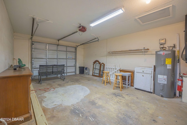 garage featuring electric water heater and a garage door opener