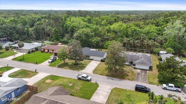 aerial view featuring a residential view and a view of trees