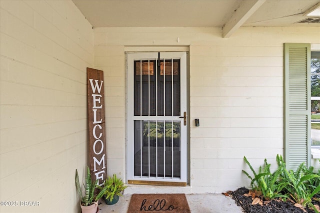 property entrance with concrete block siding