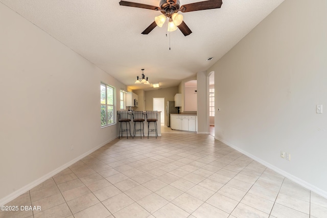 19 Meadow Ridge Vw, Ormond Beach, FL 32174 - unfurnished living room featuring a ceiling fan, a chandelier, and light tile patterned floors