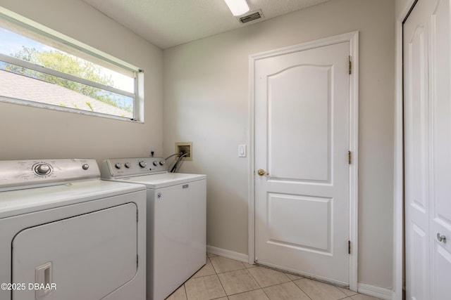 19 Meadow Ridge Vw, Ormond Beach, FL 32174 - washroom featuring washing machine and dryer and light tile patterned flooring