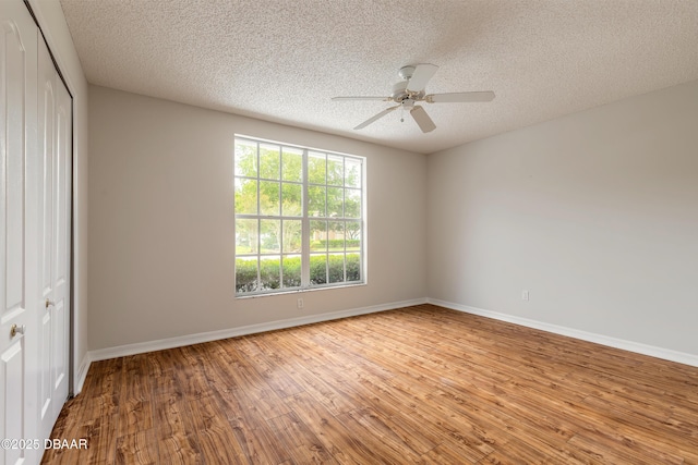 19 Meadow Ridge Vw, Ormond Beach, FL 32174 - unfurnished room with wood finished floors, a textured ceiling, and ceiling fan
