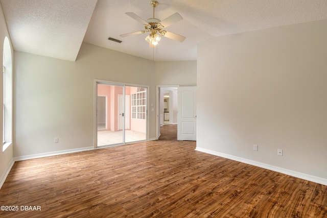 19 Meadow Ridge Vw, Ormond Beach, FL 32174 - spare room with wood finished floors, a ceiling fan, a textured ceiling, vaulted ceiling, and healthy amount of natural light