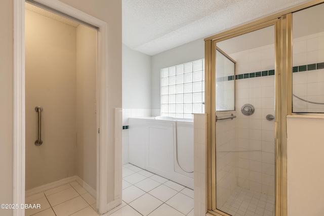 19 Meadow Ridge Vw, Ormond Beach, FL 32174 - bathroom featuring a stall shower, tile patterned floors, and a textured ceiling