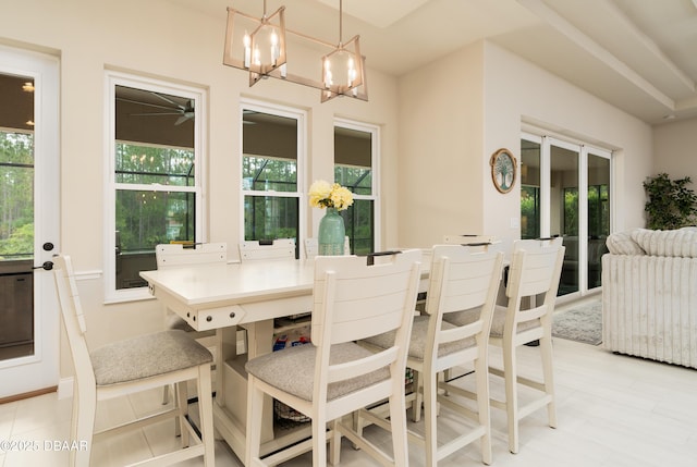 150 Portofino Blvd, New Smyrna Beach, FL 32168 - dining area featuring a chandelier and ceiling fan