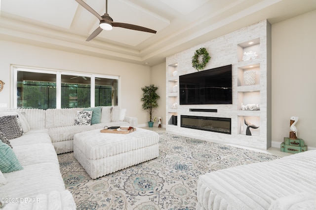 150 Portofino Blvd, New Smyrna Beach, FL 32168 - living area with ceiling fan, built in features, and a large fireplace