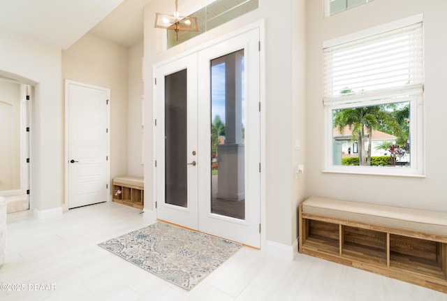 150 Portofino Blvd, New Smyrna Beach, FL 32168 - foyer entrance featuring french doors and a chandelier