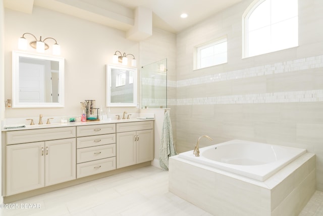 150 Portofino Blvd, New Smyrna Beach, FL 32168 - bathroom with double vanity, a garden tub, and tile patterned flooring