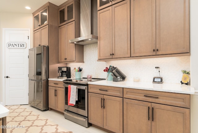 150 Portofino Blvd, New Smyrna Beach, FL 32168 - kitchen featuring stainless steel appliances, wall chimney exhaust hood, backsplash, light countertops, and recessed lighting
