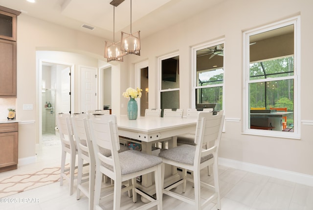 150 Portofino Blvd, New Smyrna Beach, FL 32168 - dining area featuring a chandelier and baseboards