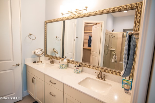 76 Longridge Ln, Ormond Beach, FL 32174 - bathroom with a stall shower, a walk in closet, and double vanity