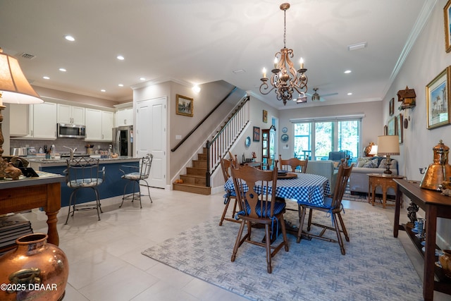 tiled dining space featuring an inviting chandelier and crown molding