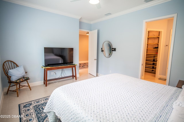 76 Longridge Ln, Ormond Beach, FL 32174 - bedroom with ornamental molding, a spacious closet, baseboards, ceiling fan, and light tile patterned floors