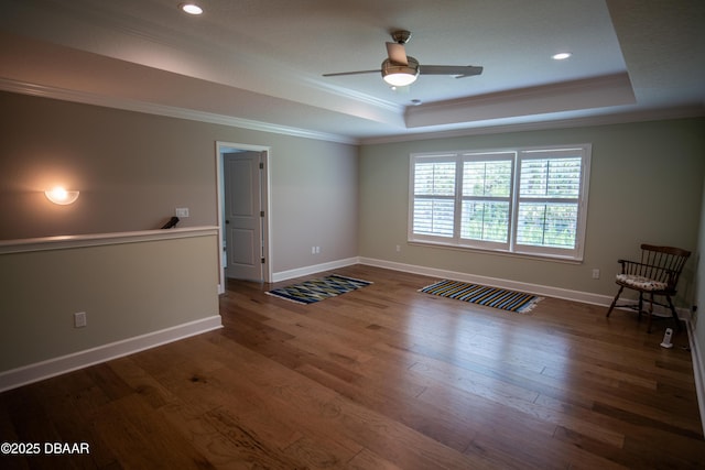 76 Longridge Ln, Ormond Beach, FL 32174 - spare room with a tray ceiling, ornamental molding, ceiling fan, baseboards, and wood finished floors