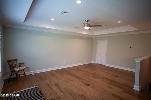 76 Longridge Ln, Ormond Beach, FL 32174 - unfurnished room featuring a raised ceiling, wood finished floors, crown molding, a ceiling fan, and baseboards