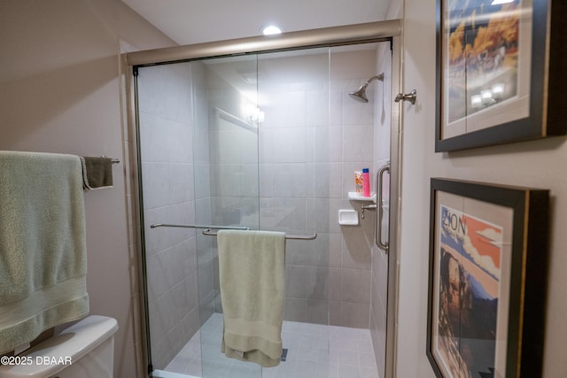 bathroom with toilet and walk in shower